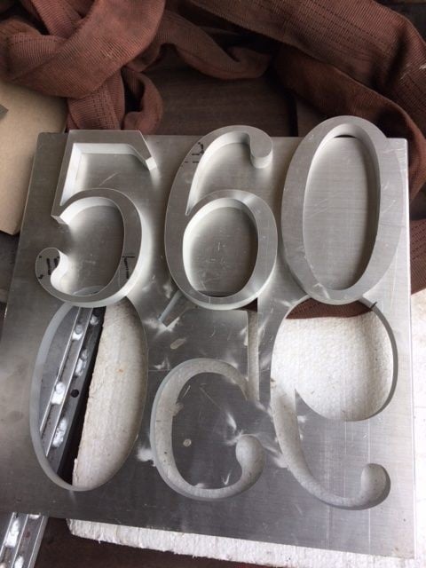 Water jet cut sign numbers
