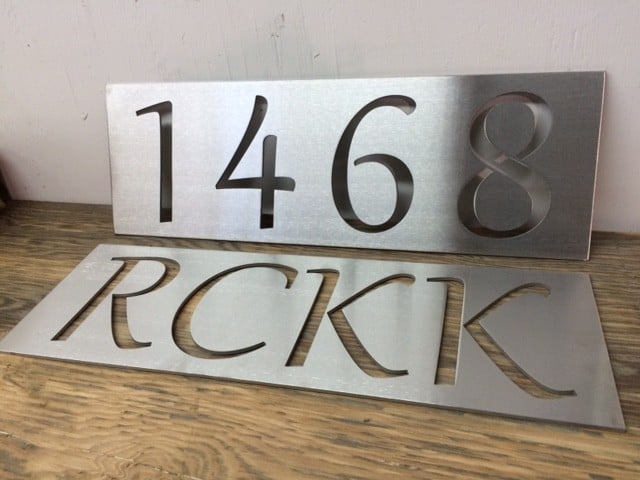 Water jet cut stainless steel sign